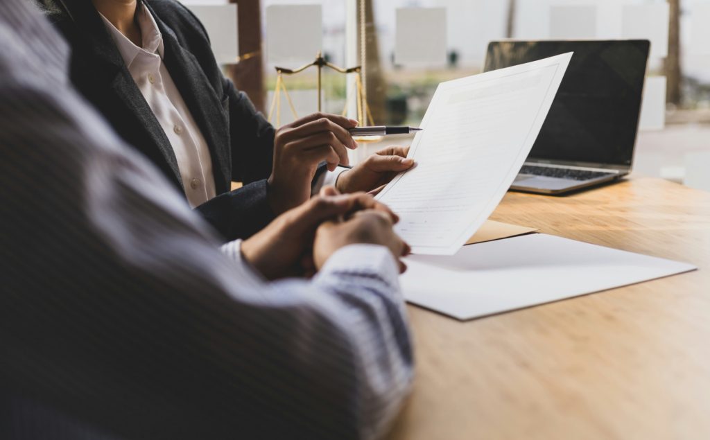 Advisor reviewing documents with a client