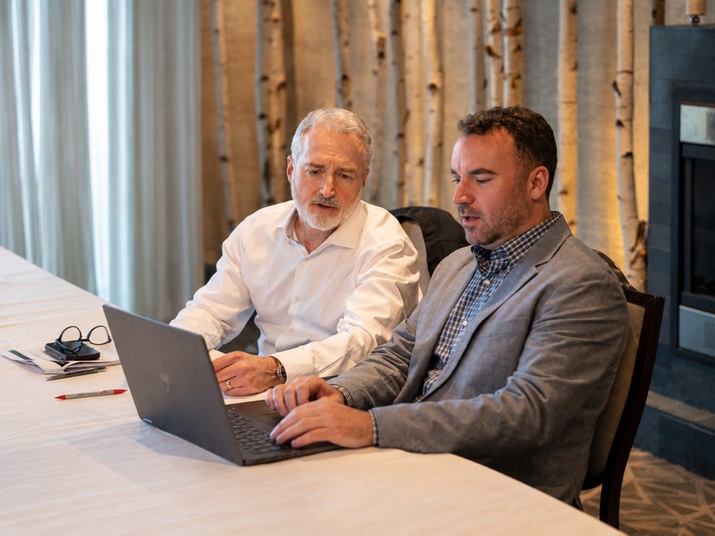 Business owners discussing key metrics