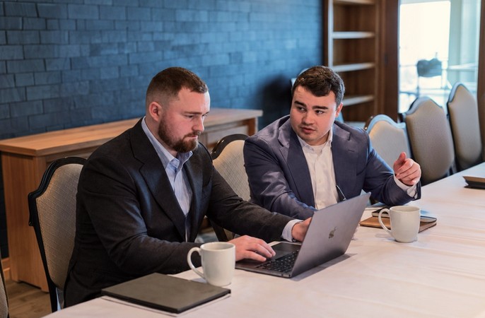 Advisors discussing the M&A timeline