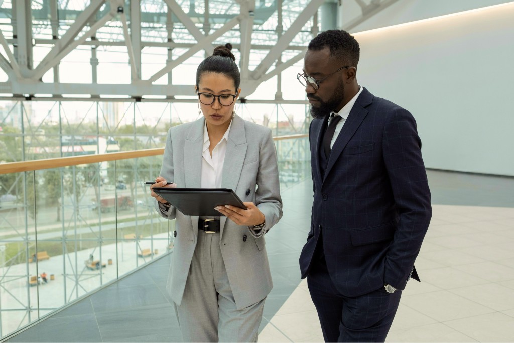 Advisors reviewing a deal on a tablet