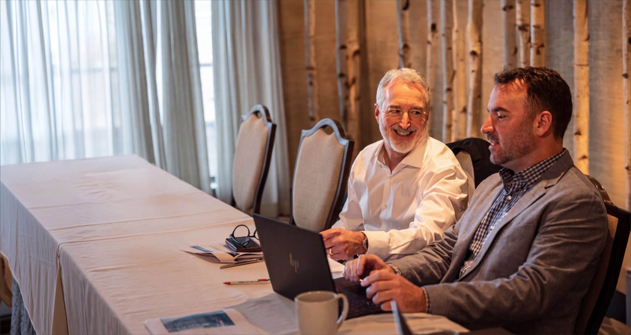Advisors meeting with a business owner