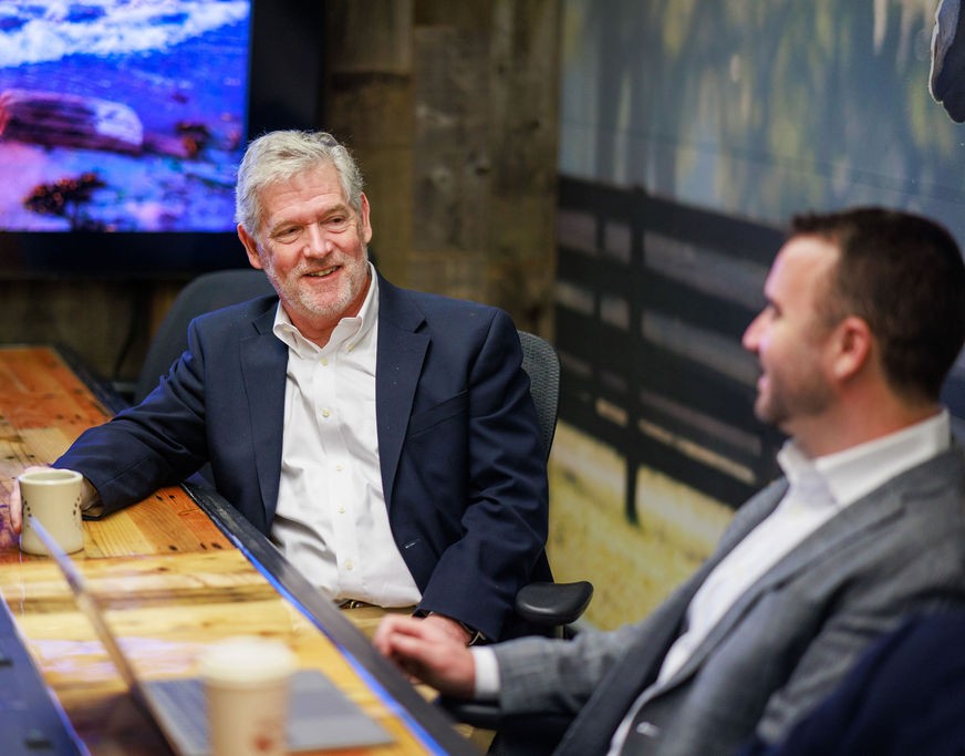Advisors discussing a technology business valuation